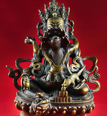 statue tibétaine de jambhala avec sa parèdre vasudhara