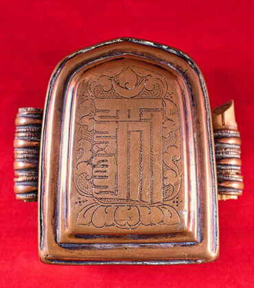 ghau tibétain avec signe du kalachakra